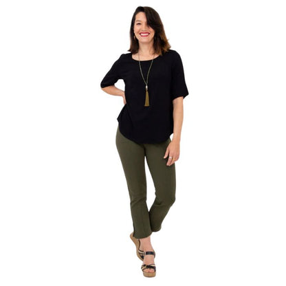 female model wearing black liza top and khaki green nadine cropped pants front view on white background