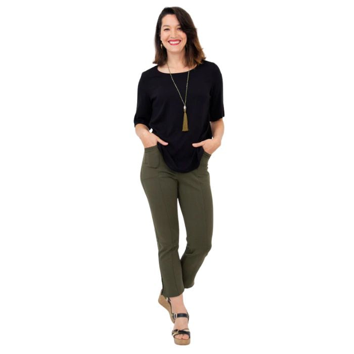 female model wearing black liza top and khaki green nadine cropped pants front view on white background
