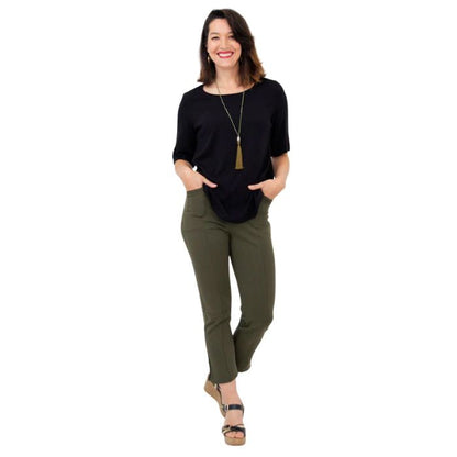 female model wearing black liza top and khaki green nadine cropped pants front view on white background