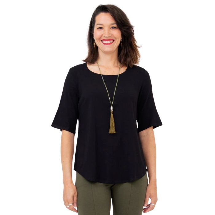 female model wearing black liza top front view on white background