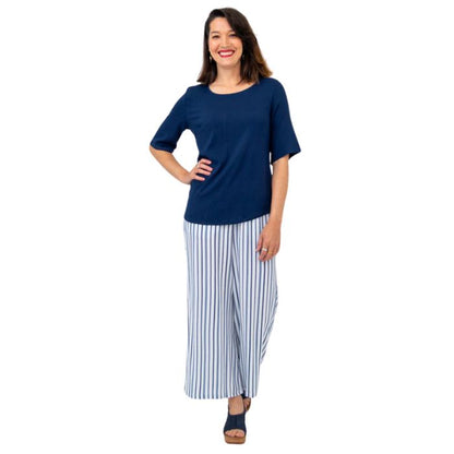 female model wearing indigo blue liza top and landon pants front view on white background