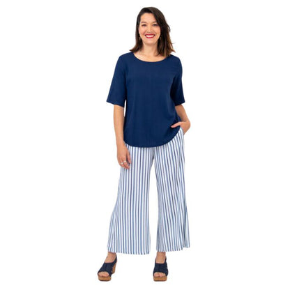 female model wearing indigo blue liza top and landon pants front view on white background