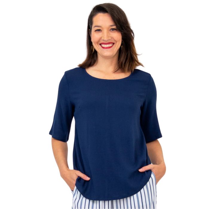 female model wearing indigo blue liza top front view on white background