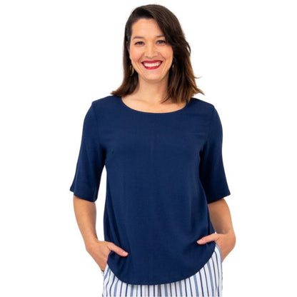 female model wearing indigo blue liza top front view on white background