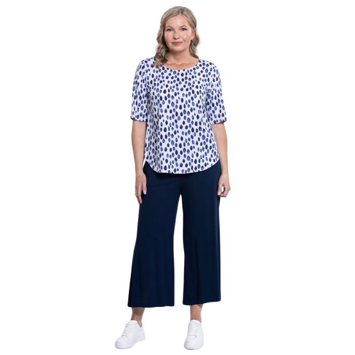 model wearing indigo rain liza top and indigo blue belle capri pants front view on white background