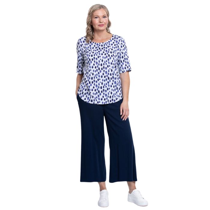 model wearing indigo rain liza top and indigo blue belle capri pants front view on white background