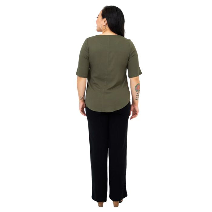female model wearing khaki green liza top and black landon pants back view on white background