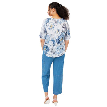 female model wearing muse print liza top and denim blue cropped pants back view on white background