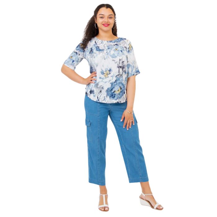 female model wearing muse print liza top and denim blue cropped pants front view on white background