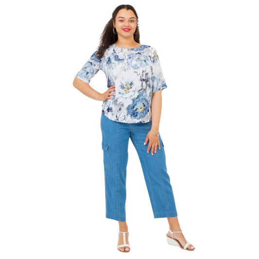 female model wearing muse print liza top and denim blue cropped pants front view on white background