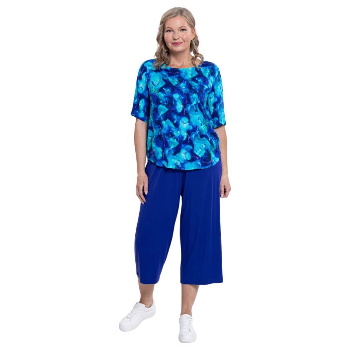 model wearing ocean reef liza top and violet gaylene capri pants front view on white background