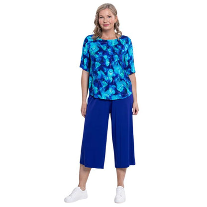 model wearing ocean reef liza top and violet gaylene capri pants front view on white background