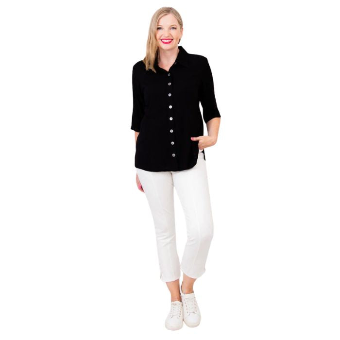 model weaing black lorine blouse and white nadine cropped pants front view on white background