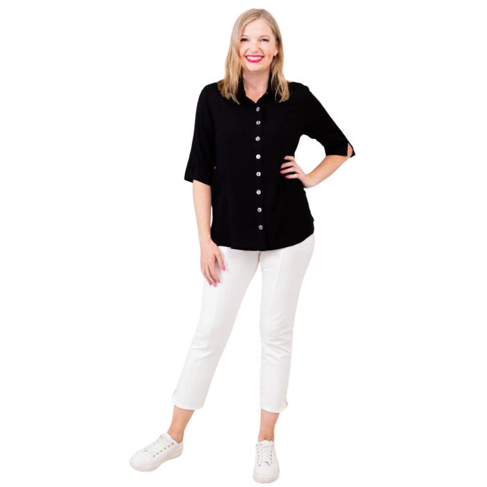 model weaing black lorine blouse and white nadine cropped pants front view on white background