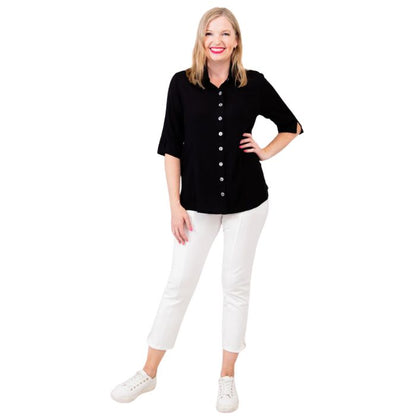 model weaing black lorine blouse and white nadine cropped pants front view on white background