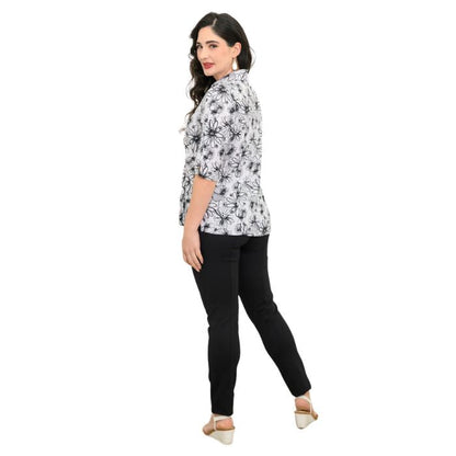 model wearing bw sketch print lorine blouse and black nadia pants back view on whitte background
