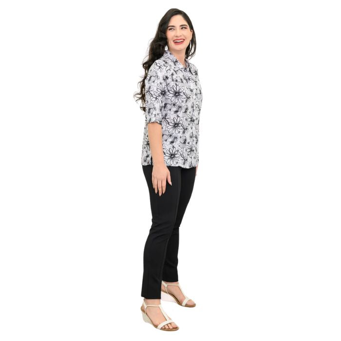 model wearing bw sketch print lorine blouse and black nadia pants side view on whitte background