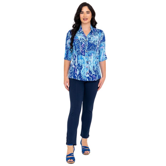 model wearing curious print lorine blouse and indigo blue nadia pants  front view on whitte background