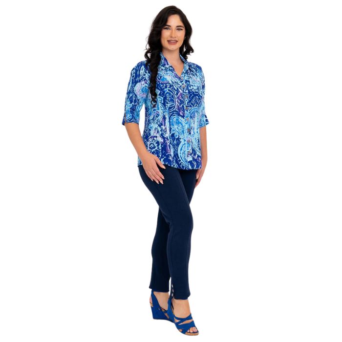 model wearing curious print lorine blouse and indigo blue nadia pants side view on whitte background