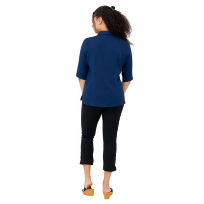 model weaing indigo blue lorine blouse and nadine cropped pants back view on white background
