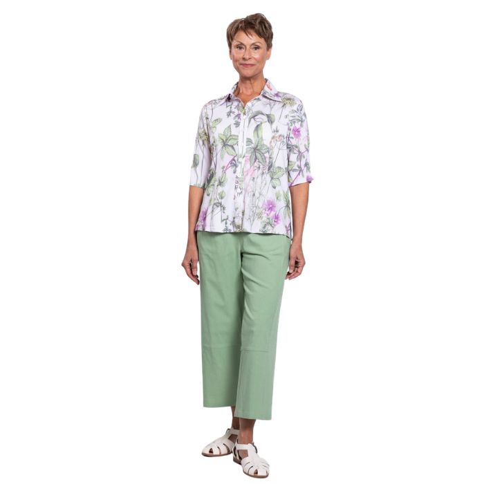 model wearing khaki clover print lorine blouse and sage green boardwalk capri pants front view on whitte background