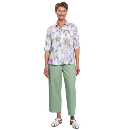 model wearing khaki clover print lorine blouse and sage green boardwalk capri pants front view on whitte background