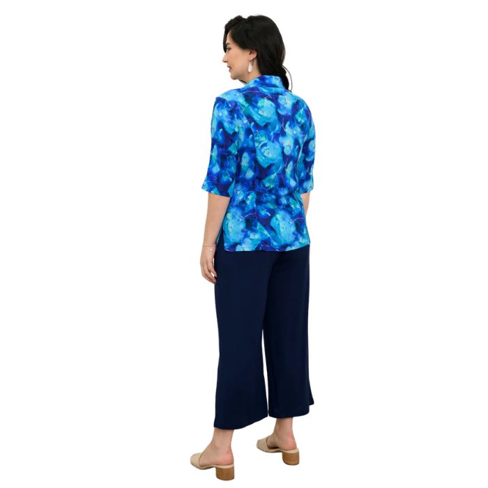model wearing ocean reef print lorine blouse and indigo blue belle capri pants back view on white background