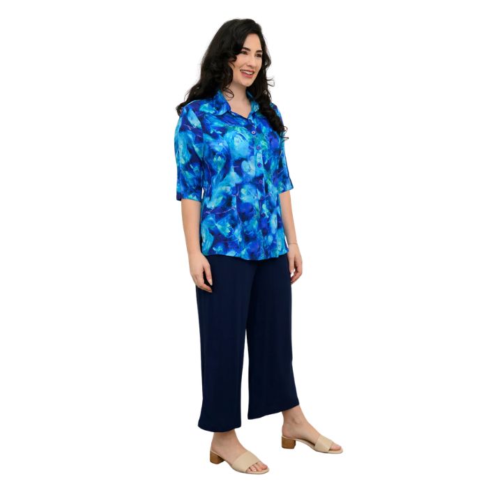 model wearing ocean reef print lorine blouse and indigo blue belle capri pants  side view on whitte background