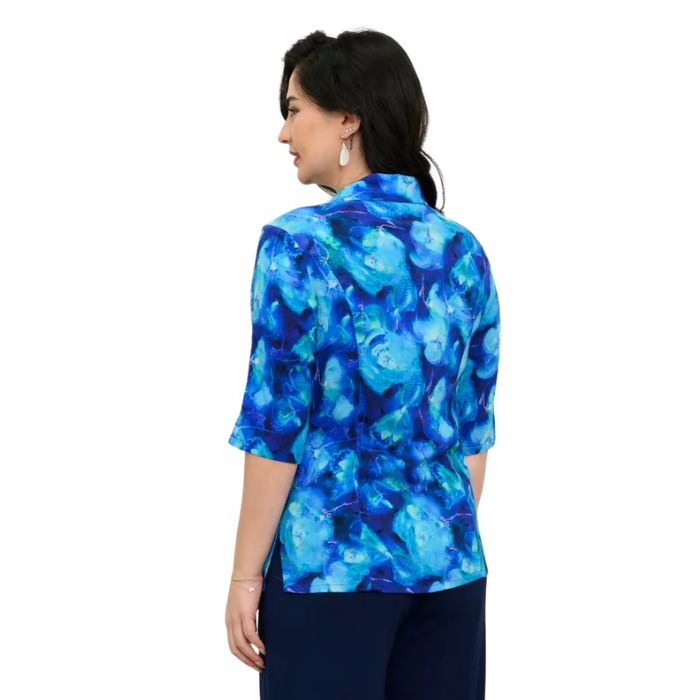 model wearing ocean reef print lorine blouse back view on white background