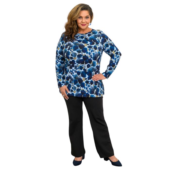 a woman wearing blue wind print margie top and black daya pants front view set on a studio white background