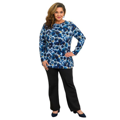 a woman wearing blue wind print margie top and black daya pants front view set on a studio white background