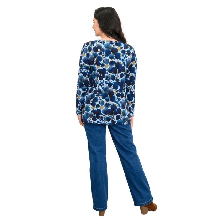 a woman wearing blue wind print margie top and denim blue jeans back view set on a studio white background