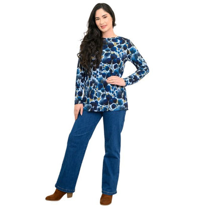 a woman wearing blue wind print margie top and denim blue jeans front view set on a studio white background