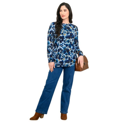 a woman wearing blue wind print margie top and denim blue jeans front view set on a studio white background