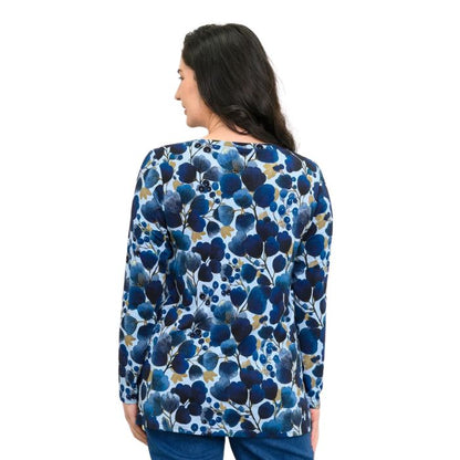 a woman wearing blue wind print margie top waist up back view set on a studio white background