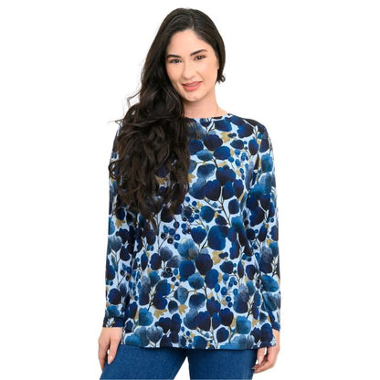 a woman wearing blue wind print margie top waist up front view set on a studio white background