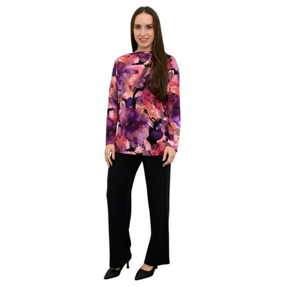 a woman wearing royale garden print margie top and black daya pants front view set on a studio white background