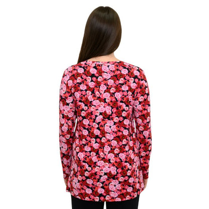 a woman wearing vermillion rose print margie top waist up back view set on a studio white background