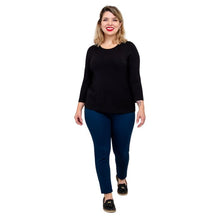 model wearing margorie black three quarter sleeve top black and nadia indigo blue pants front view on white background