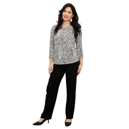 female model wearing rosette print margorie three quarter sleeve top and black nadia pants front view on white background