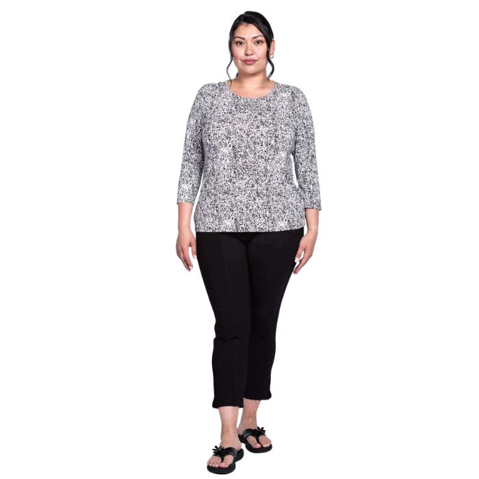 female model wearing rosette print margorie three quarter sleeve top and black nadine cropped pants front view on white background