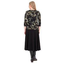 female model wearing margorie khaki oak three quarter sleeve top print and gillian black long skirt back view on white background
