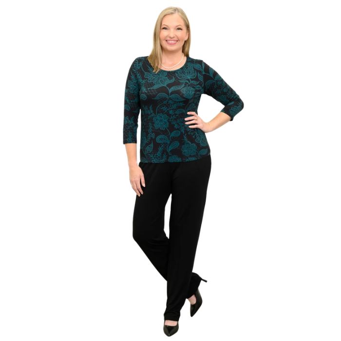 woman wearing margorie teal boscage print three quarter sleeve top and black nadia pants front view set on a white background 