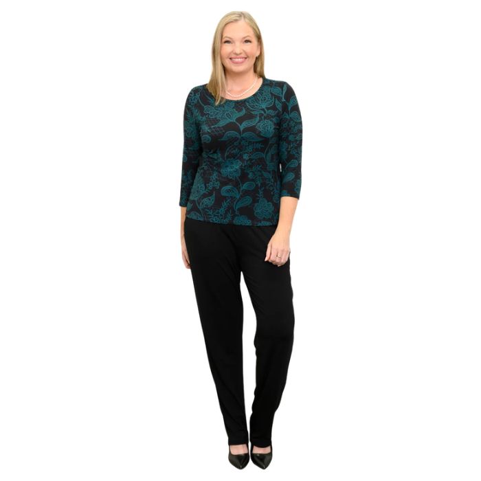 woman wearing margorie teal boscage print three quarter sleeve top and black nadia pants front view set on a white background 