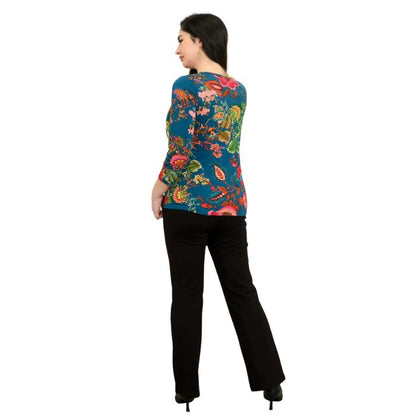 female model wearing teal fantasy print margorie three quarter sleeve top and black daya pants back view on white background