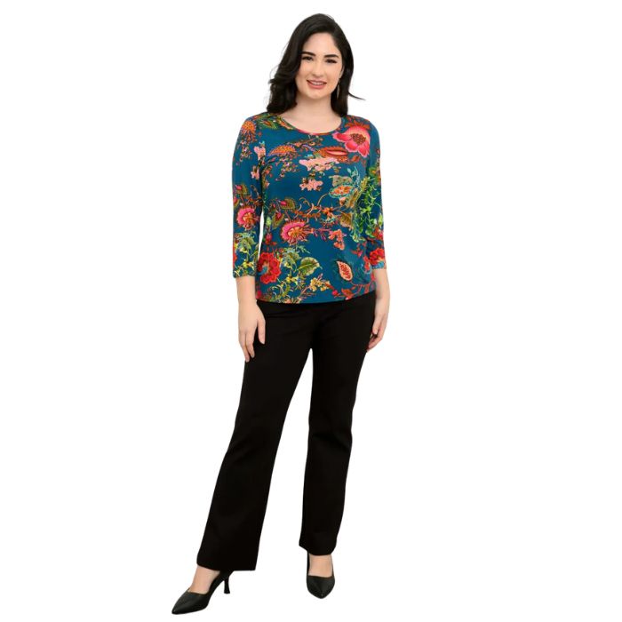 female model wearing teal fantasy print margorie three quarter sleeve top and black daya pants front view on white background