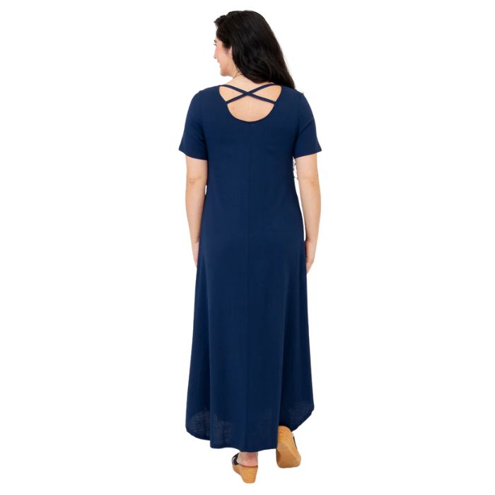 female model wearing indigo blue martha dress front view on white background