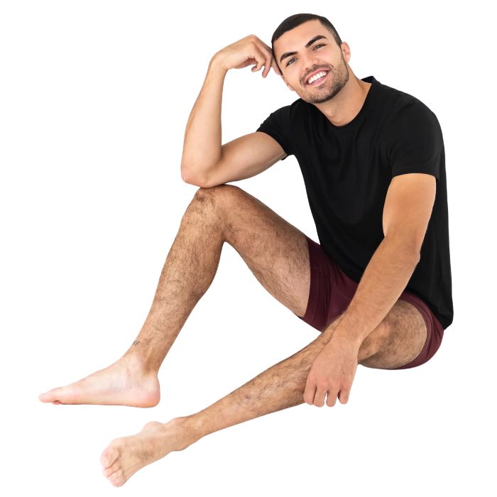 man wearing maroon red boxer briefs and black lawrence crew tee front view set on a white background