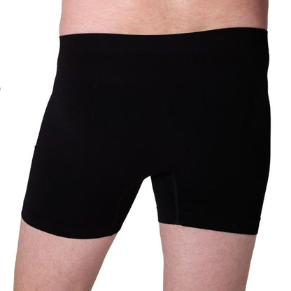 body of male model wearing black boxer briefs back view on white background