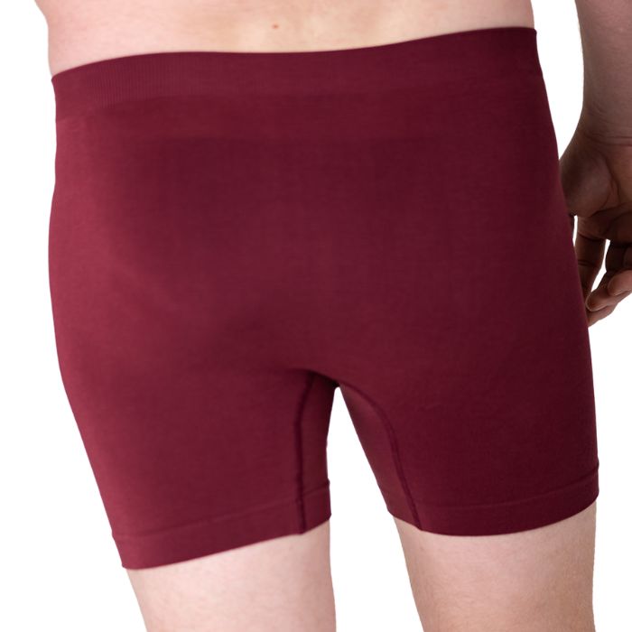 body of male model wearing maroon red boxer briefs back view on white background